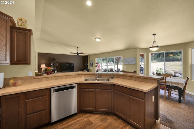 kitchen with dishwasher, sink, ceiling fan, decorative light fixtures, and kitchen peninsula