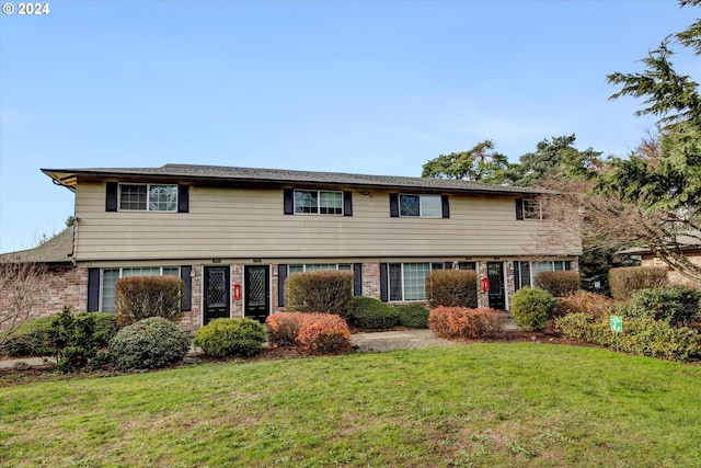 view of front of property with a front lawn