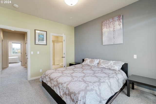 carpeted bedroom with ensuite bath