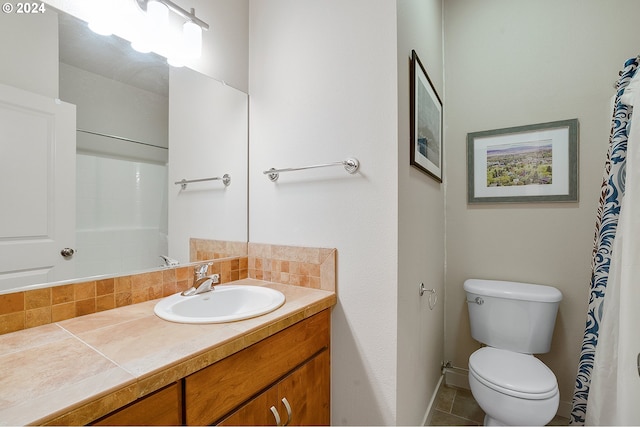 bathroom with tile patterned flooring, vanity, toilet, and a shower with shower curtain