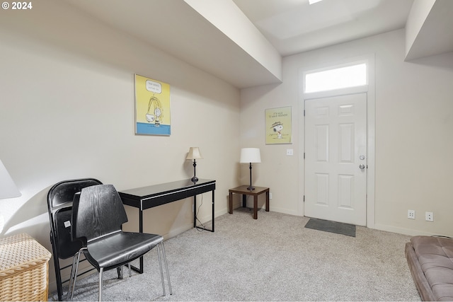 view of carpeted foyer entrance