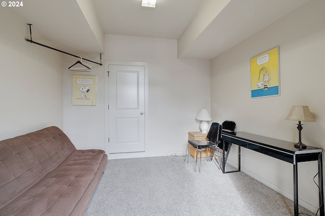 sitting room featuring carpet flooring