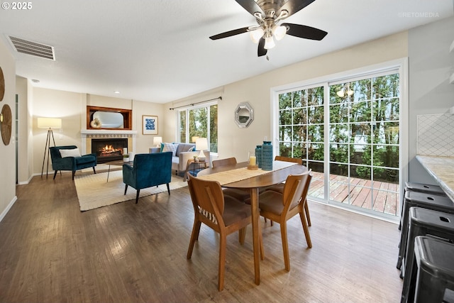 dining area featuring ceiling fan and wood-type flooring