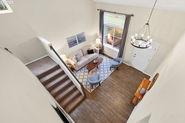 living room with hardwood / wood-style flooring and a chandelier