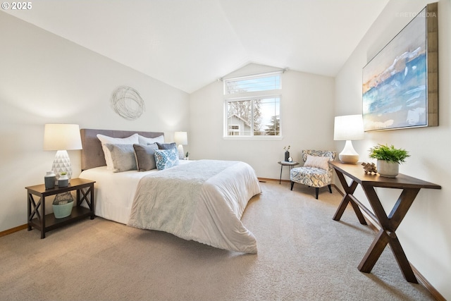 bedroom featuring vaulted ceiling and light colored carpet