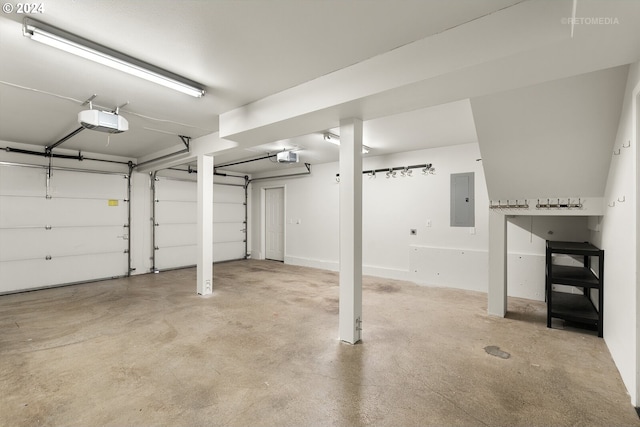 garage featuring a garage door opener and electric panel