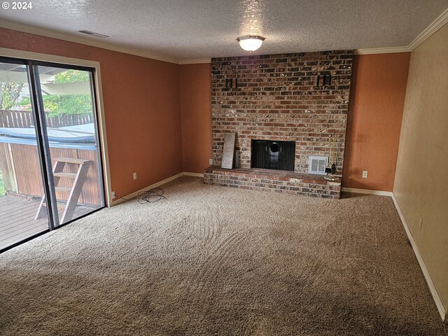 unfurnished living room with ornamental molding, carpet flooring, a brick fireplace, and a textured ceiling