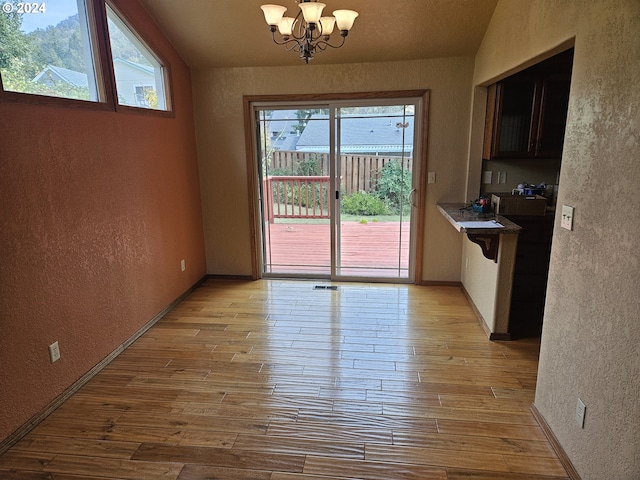 dining room with a notable chandelier and light hardwood / wood-style floors