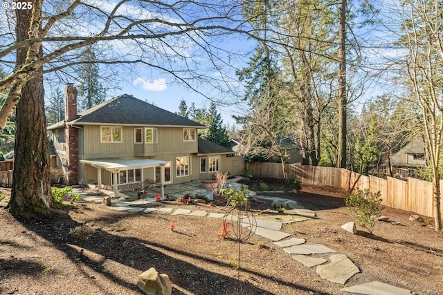 rear view of property with a patio area