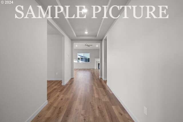 hall with wood-type flooring