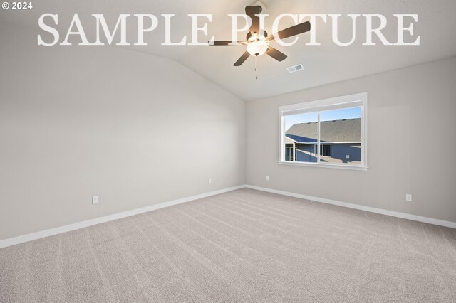 unfurnished room with lofted ceiling, carpet floors, and ceiling fan