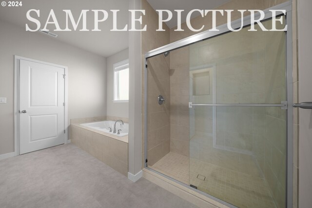 bathroom with shower with separate bathtub