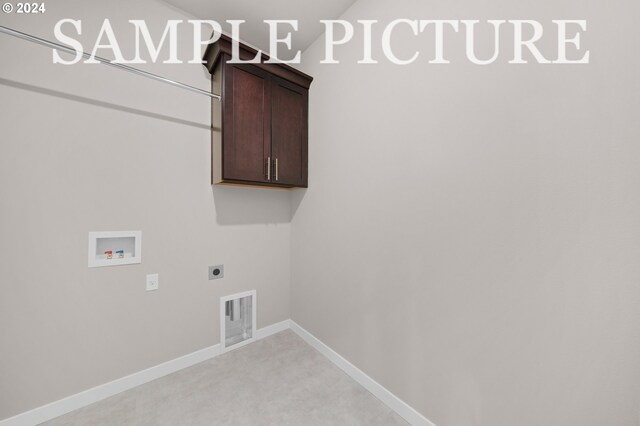 washroom with washer hookup, electric dryer hookup, cabinets, and carpet floors