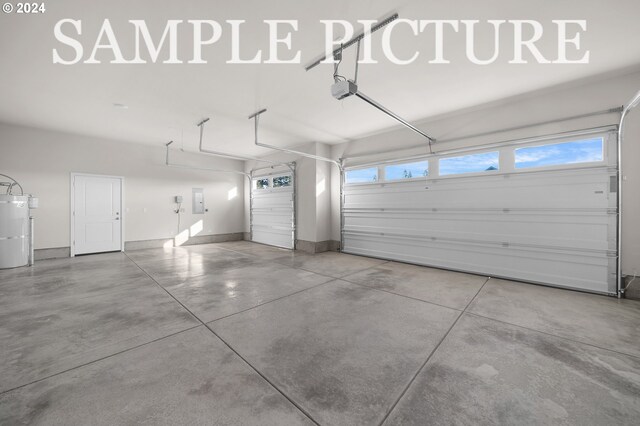 garage featuring water heater and a garage door opener