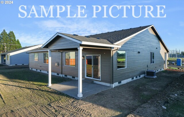 rear view of property featuring central AC unit and a patio