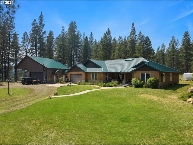 single story home with a garage and a front lawn