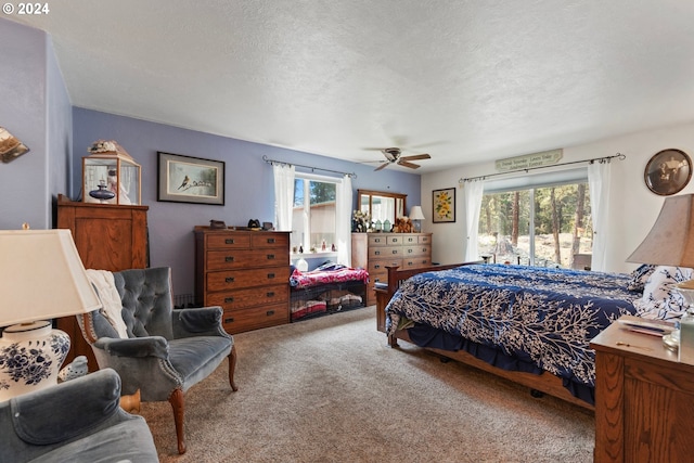 carpeted bedroom featuring ceiling fan, a textured ceiling, and access to outside