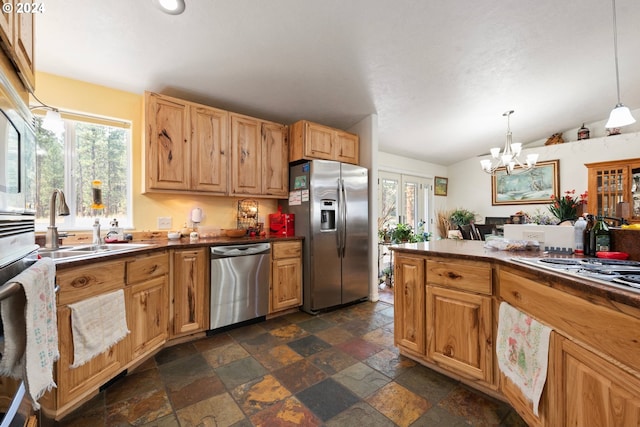 kitchen with sink, decorative light fixtures, plenty of natural light, and stainless steel appliances