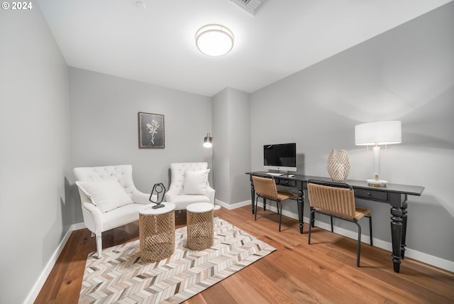 living area with light hardwood / wood-style flooring