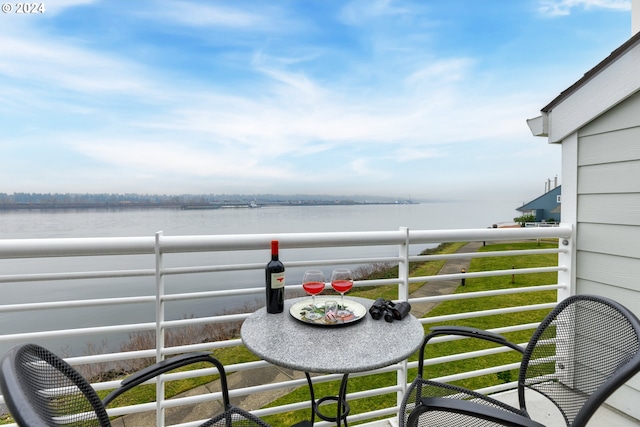 balcony featuring a water view