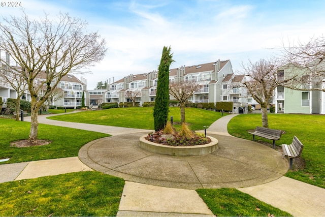 view of community featuring a yard