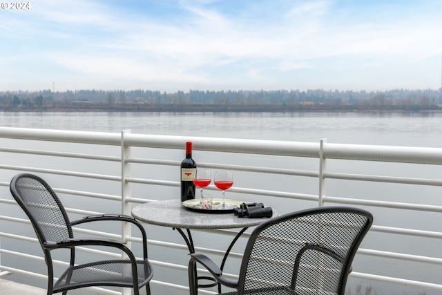 balcony featuring a water view