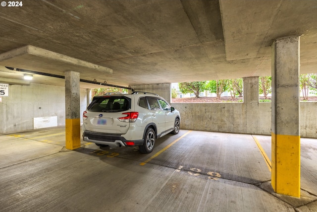 garage featuring a carport