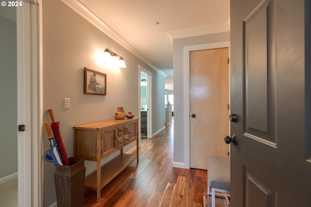 entrance foyer featuring hardwood / wood-style floors and crown molding