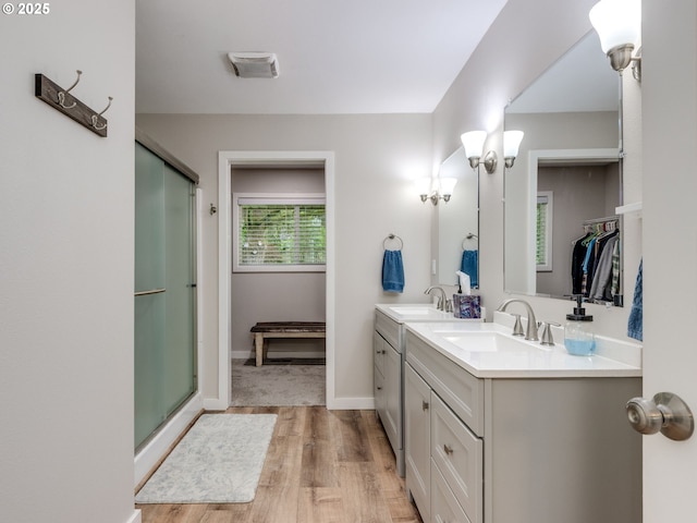 15836 SW Division St, Sherwood, OR 97140 - full bath featuring wood finished floors, a stall shower, double vanity, and baseboards