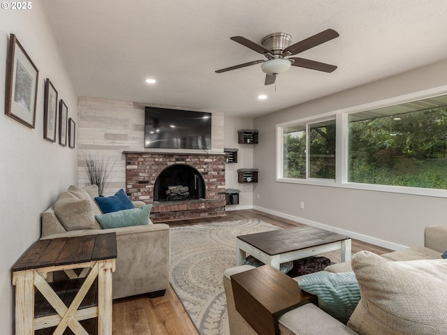 15836 SW Division St, Sherwood, OR 97140 - living room featuring wood finished floors, recessed lighting, ceiling fan, a fireplace, and baseboards