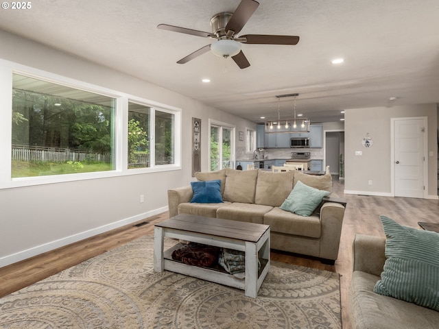 15836 SW Division St, Sherwood, OR 97140 - living area with baseboards, ceiling fan, light wood finished floors, and recessed lighting