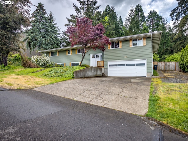 15836 SW Division St, Sherwood, OR 97140 - bi-level home with an attached garage, fence, and concrete driveway