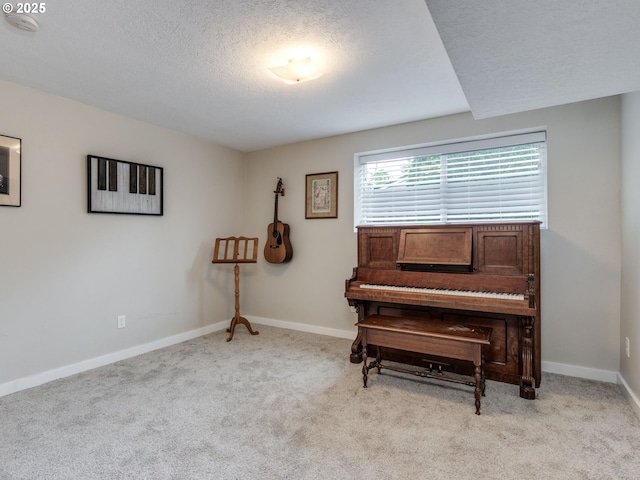 15836 SW Division St, Sherwood, OR 97140 - living area with carpet flooring, a textured ceiling, and baseboards