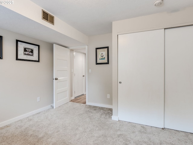 15836 SW Division St, Sherwood, OR 97140 - unfurnished bedroom featuring carpet floors, baseboards, and a closet