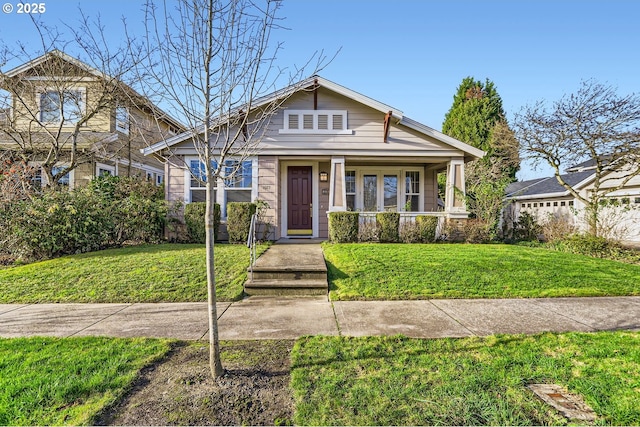 bungalow-style house featuring a porch and a front yard