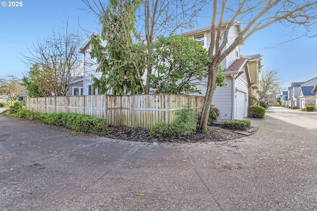 view of side of property featuring a garage