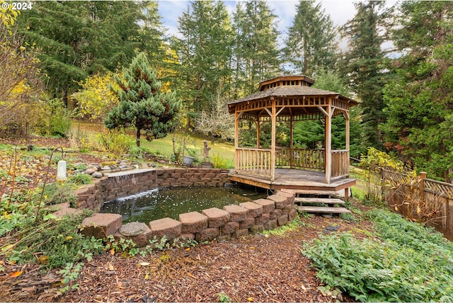 view of yard featuring a gazebo and a deck