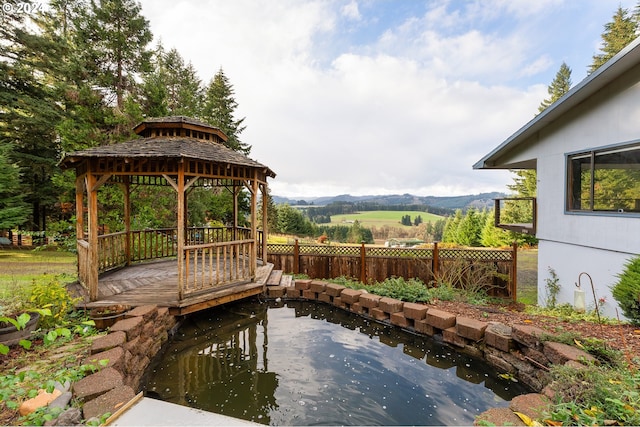 view of patio featuring a mountain view and a gazebo