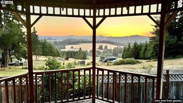 386 Longview Dr, Elkton, OR 97436 - wooden deck featuring a mountain view and a view of rural / pastoral area