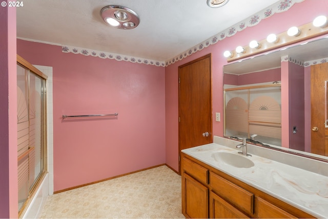 386 Longview Dr, Elkton, OR 97436 - bathroom with tile patterned floors, vanity, combined bath / shower with glass door, and baseboards