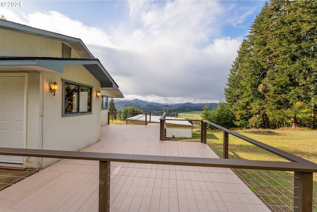 wooden deck with a mountain view