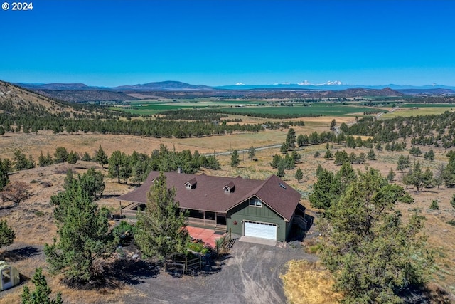 birds eye view of property featuring a mountain view