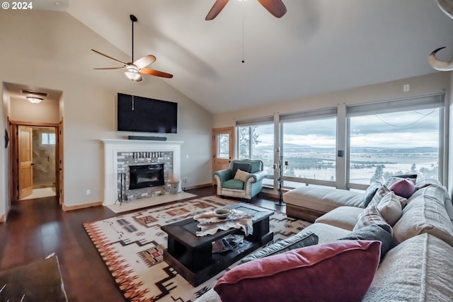 living room with ceiling fan, dark wood-type flooring, and high vaulted ceiling