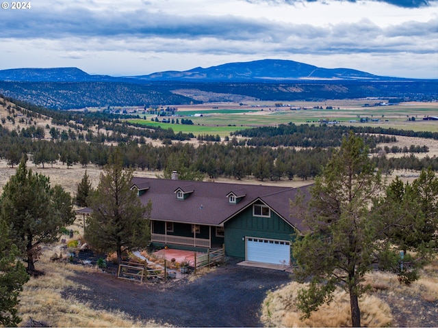 drone / aerial view with a mountain view and a rural view