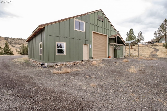 view of outbuilding with a mountain view and a garage