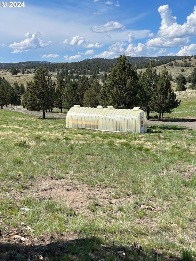 view of mountain feature featuring a rural view