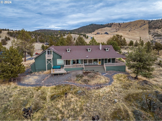 back of house with a mountain view