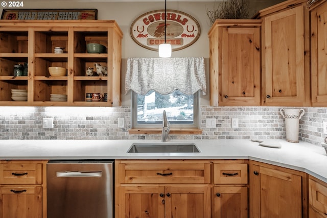 kitchen with dishwasher, sink, decorative backsplash, and hanging light fixtures