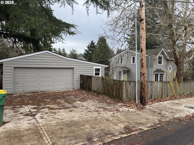 exterior space with an outbuilding and a garage