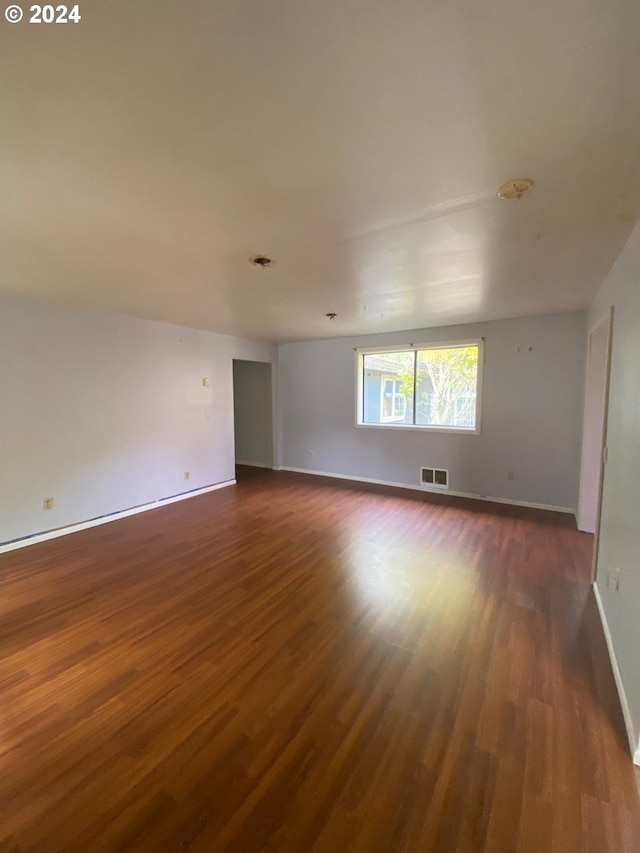 empty room featuring dark hardwood / wood-style floors